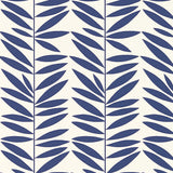 Leaf Stripe wallpaper in Marine by Schumacher, featuring a bold blue leaf pattern on a white background, shown in bedroom and bathroom settings.