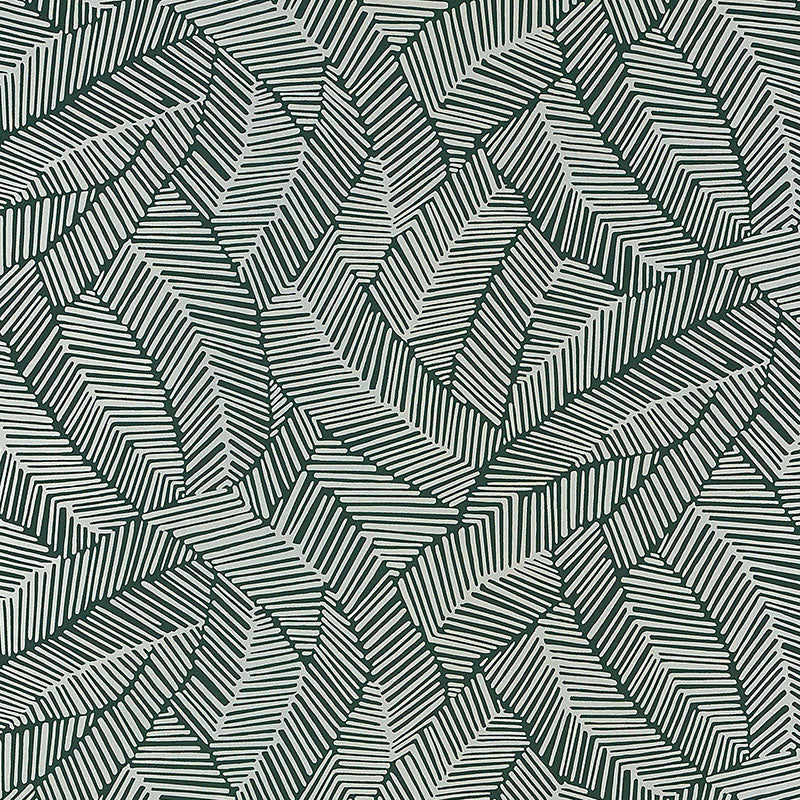 Abstract leaf patterned wallpaper in metallic slate, shown in a modern bathroom setting by Schumacher.