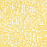 FEATHERFEST wallpaper in citron yellow with a graphic feather pattern, shown in a bathroom interior by Schumacher.