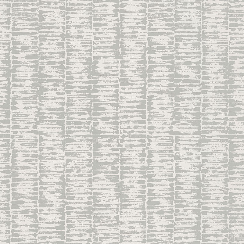 VARIATIONS wallpaper in Gris by Schumacher features variegated stripes with a brushstroke pattern reminiscent of bamboo stalks in soft grey tones.