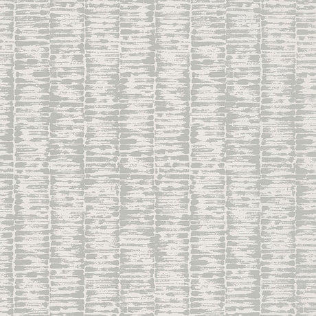 VARIATIONS wallpaper in Gris by Schumacher features variegated stripes with a brushstroke pattern reminiscent of bamboo stalks in soft grey tones.