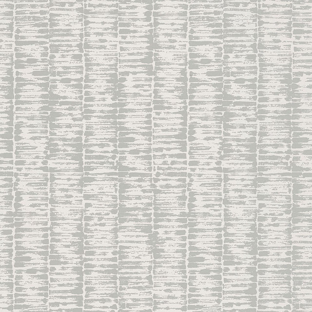 VARIATIONS wallpaper in Gris by Schumacher features variegated stripes with a brushstroke pattern reminiscent of bamboo stalks in soft grey tones.