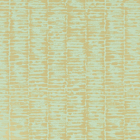 VARIATIONS Golden Leaf wallpaper by Schumacher features variegated stripes in a brushstroke pattern reminiscent of bamboo stalks, in a soft golden colorway.