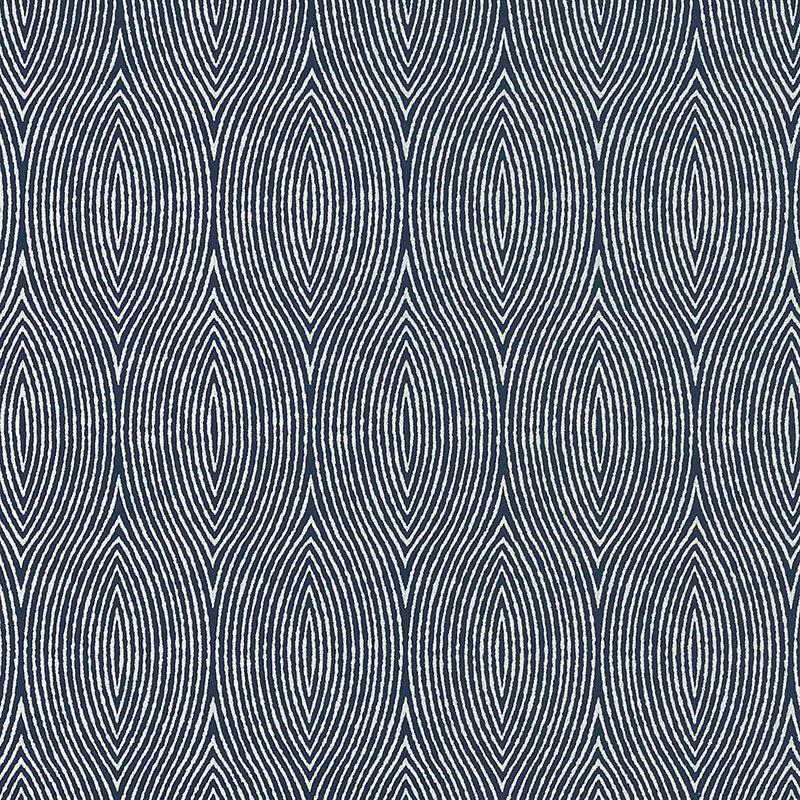 Bark wallpaper in Twilight by Schumacher, featuring graphic concentric ogee wood grain patterns in deep blue and off-white.