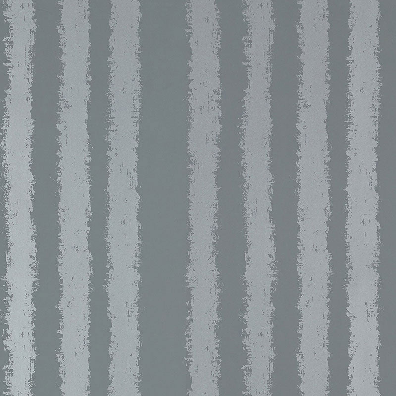 Tree Stand wallpaper in Slate Shimmer by Schumacher features irregular vertical stripes with softly blurred edges in a shimmering slate colorway.