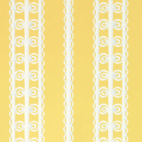 Wicker Stripe wallpaper in Lemon Blossom by Schumacher, featuring a yellow background with white wicker-inspired vertical stripes. Shown in a styled bedroom interior.