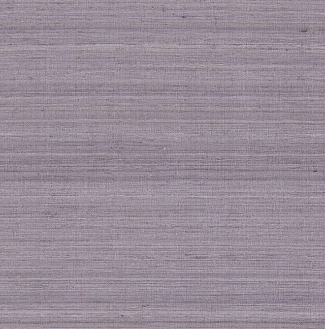 Shaded Silk Thistle fabric wallcovering by Schumacher, featuring a striated silk texture in a soft purple hue.
