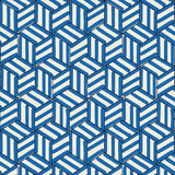 TUMBLING BLOCKS cobalt blue geometric wallpaper by Schumacher shown in various interior settings, including bedroom and bathroom installations.