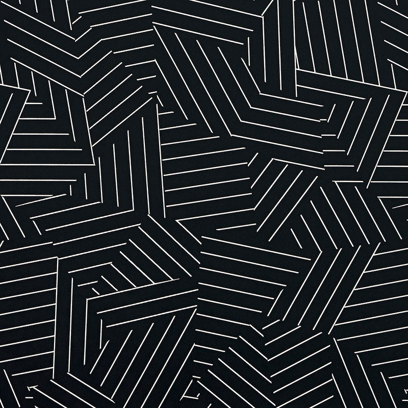 Deconstructed Stripe wallpaper in ivory on black by Schumacher, featuring a modern geometric stripe pattern.