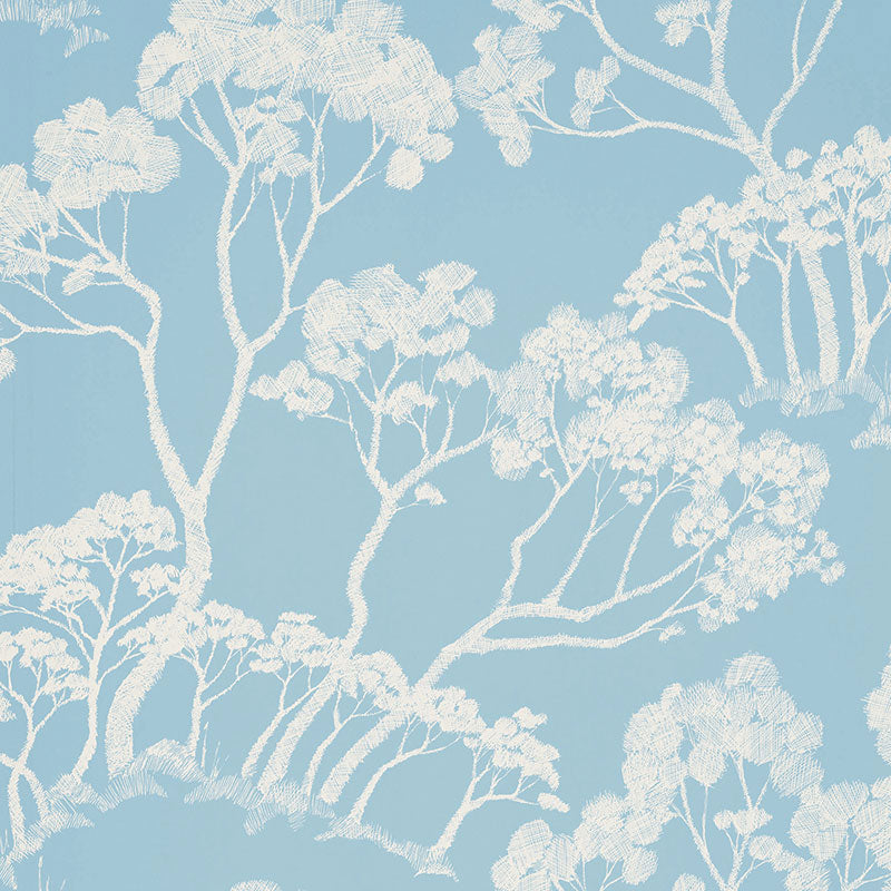 Timber! wallpaper in Cloud by Schumacher features a hand-drawn tree motif in a soft blue and white colorway, perfect for adding a natural, artistic touch to interiors.