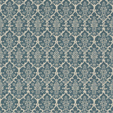 Burley Peacock Blue wallpaper by Schumacher, a floral lattice hand-blocked design in blue and cream, styled in a bathroom interior.