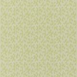 Montpellier Lime Blossom wallpaper by Schumacher in a bathroom setting, featuring a subtle geometric pattern in light green.