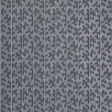 Montpellier Silver Stellar wallpaper by Schumacher in a modern bathroom setting, featuring a dotted geometric pattern in silver and grey tones.