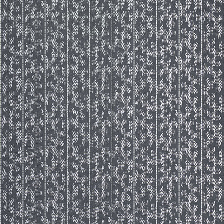 Montpellier Silver Stellar wallpaper by Schumacher in a modern bathroom setting, featuring a dotted geometric pattern in silver and grey tones.