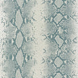Snake Charmer Mineral animal print wallpaper by Schumacher, shown in a modern interior setting with a bold snakeskin pattern.