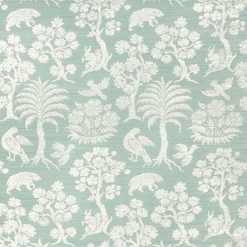 Woodland Silhouette Sisal wallpaper in Sky by Schumacher, featuring a charming animal and tree silhouette pattern in a soft blue colorway.