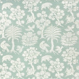 Woodland Silhouette Sisal wallpaper in Sky by Schumacher, featuring a charming animal and tree silhouette pattern in a soft blue colorway.