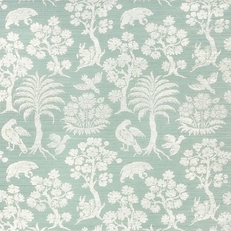 Woodland Silhouette Sisal wallpaper in Sky by Schumacher, featuring a charming animal and tree silhouette pattern in a soft blue colorway.