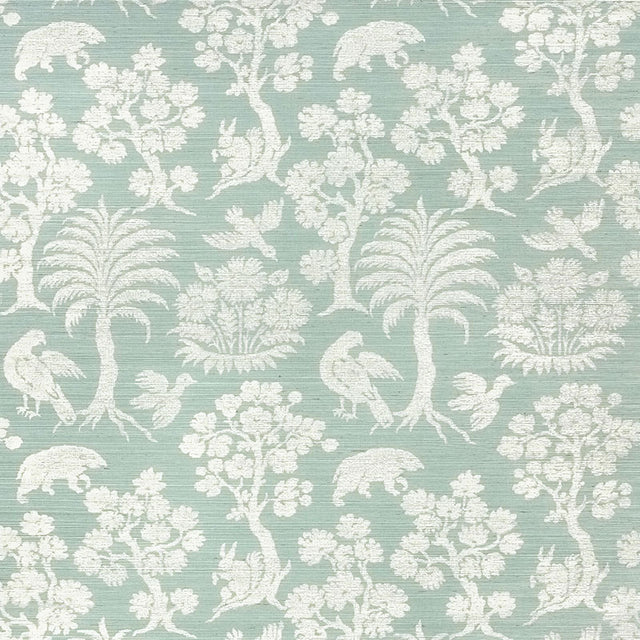 Woodland Silhouette Sisal wallpaper in Sky by Schumacher, featuring a charming animal and tree silhouette pattern in a soft blue colorway.