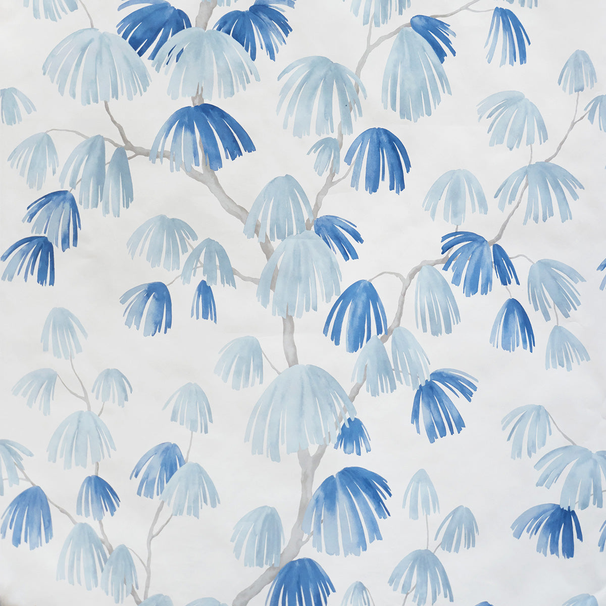 Weeping Pine wallpaper in Slate by David Kaihoi for Schumacher, featuring a sweeping botanical pattern in blue and grey watercolor tones.