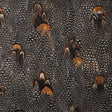 Lodestone wallcovering in coral with a dense, allover hand-applied feather pattern by Schumacher.