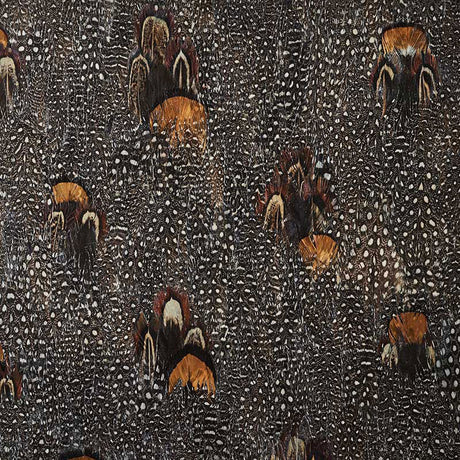 Lodestone wallcovering in coral with a dense, allover hand-applied feather pattern by Schumacher.
