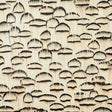 Opal wallcovering panel in white with hand-applied natural striped feathers, graphic and textural design by Schumacher.
