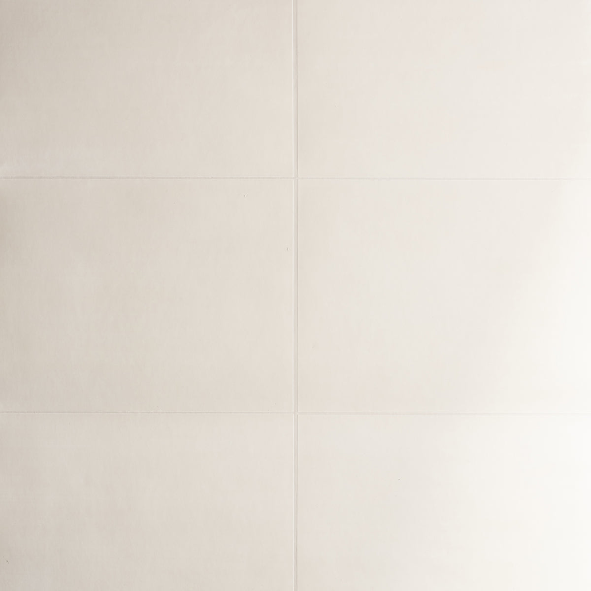 Glossed Vellum cream wallcovering by Schumacher shown in a modern dining room setting with a handcrafted parchment lookalike finish.