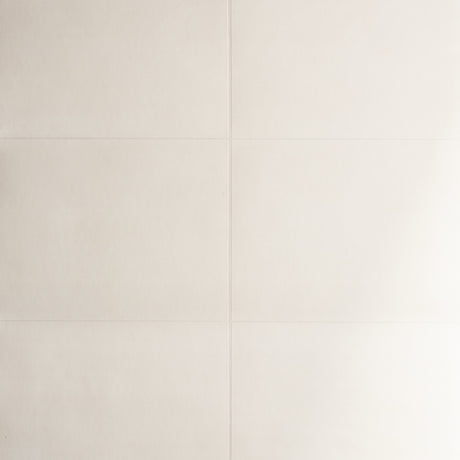 Glossed Vellum cream wallcovering by Schumacher shown in a modern dining room setting with a handcrafted parchment lookalike finish.