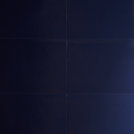 Glossed Vellum navy blue wallcovering with a luxe, luminous finish by Schumacher.