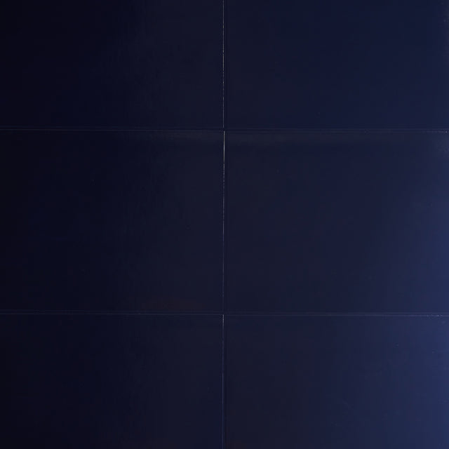 Glossed Vellum navy blue wallcovering with a luxe, luminous finish by Schumacher.