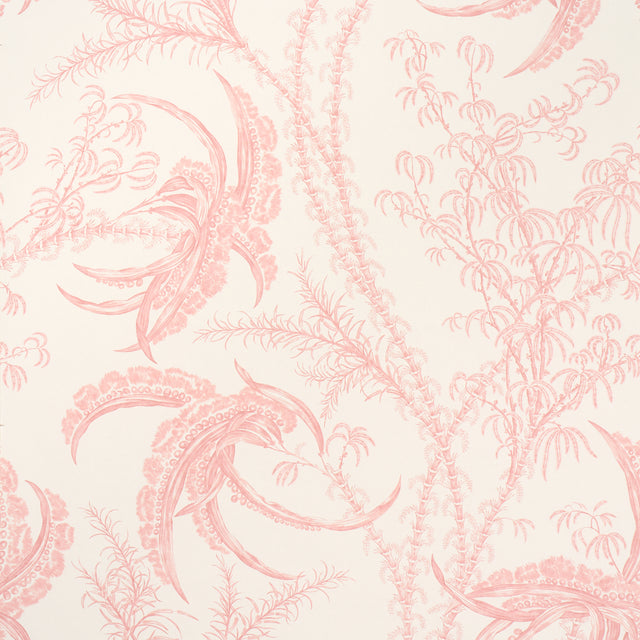 Ocean Toile wallpaper in coral by Schumacher, featuring an undersea toile pattern in pink on a white background, shown in a styled bathroom interior.
