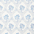 Marella Delft wallpaper by Schumacher featuring a wavy trellis and blue botanical motifs in a traditional interior setting.