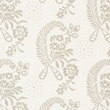 Millicent Grisaille wallpaper by Schumacher, a delicate floral surface-printed design with vintage appeal, shown in a styled bedroom interior.