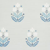 Floweret Sisal wallpaper in blue and white, featuring a large-scale stylized floral pattern on textured sisal background.