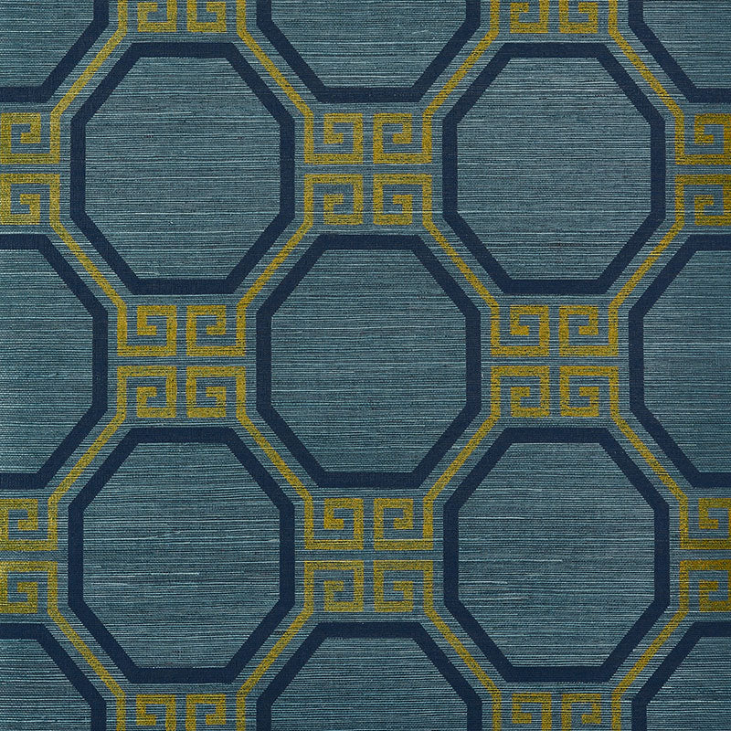 Octavia Sisal wallpaper in Peacock by Schumacher, featuring an octagonal geometric pattern with Greek key accents in blue and gold tones.