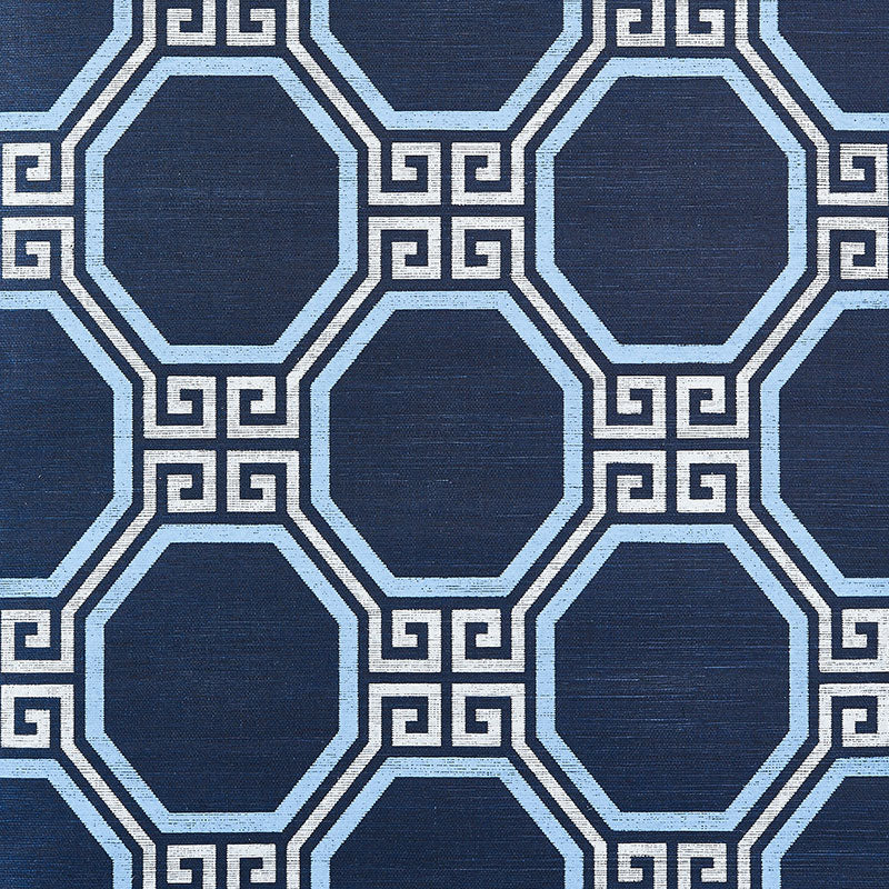 Octavia Sisal navy blue geometric Greek key octagonal pattern wallpaper by Schumacher shown in a styled bathroom interior.