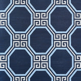 Octavia Sisal navy blue geometric Greek key octagonal pattern wallpaper by Schumacher shown in a styled bathroom interior.
