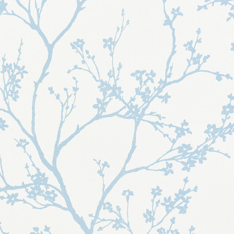 Twiggy Paperweave wallpaper in Sky by Schumacher, featuring a delicate blue botanical silhouette on a textured paperweave background.