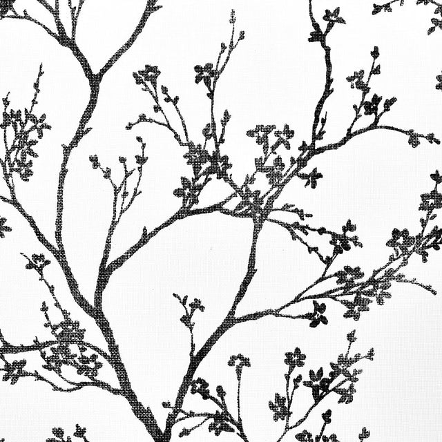 Twiggy Paperweave wallpaper in black by Schumacher, featuring a delicate botanical silhouette pattern on a textured paperweave ground.