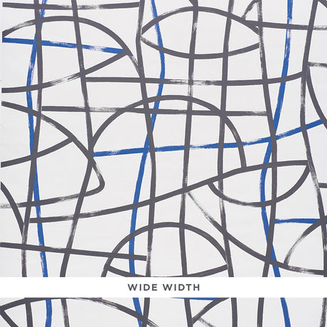 Abstratto Black & Cobalt abstract geometric wide-width wallpaper by Schumacher, shown in a modern bedroom setting.