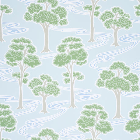 Tree River wallpaper in Mineral by Schumacher, featuring stylized green trees and flowing blue river on a light background, shown in a bedroom setting.