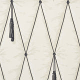 Bone colored trompe l'oeil wallpaper with diamond tufting and tassel design by Schumacher