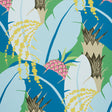 Tropical pineapple and banana leaf wallpaper in vibrant peacock blue, green, and yellow by Schumacher.