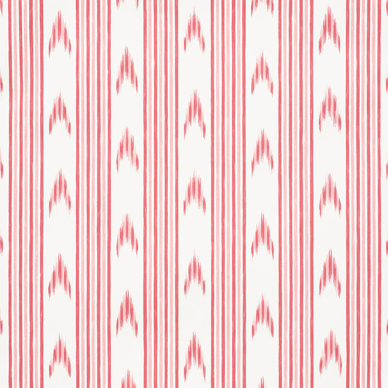 Santa Barbara Ikat pink wallpaper by Schumacher in a bathroom setting, featuring a vertical ikat stripe pattern.