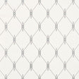 DISO by David Oliver for Schumacher, blue trellis pattern wallpaper in a bedroom setting