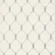 DISO Parchment trellis pattern wallpaper by Schumacher, designed by David Oliver, shown in a bedroom setting.