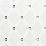 ASOLO by David Oliver for Schumacher. Blue and white argyle trellis geometric wallpaper in a modern entryway.