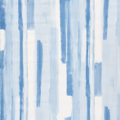 Watercolor blue abstract stripe wallpaper by Schumacher, styled in a modern interior setting.