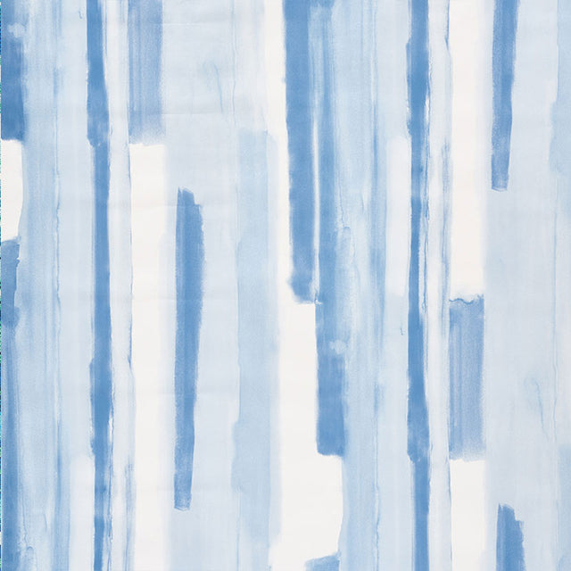 Watercolor blue abstract stripe wallpaper by Schumacher, styled in a modern interior setting.